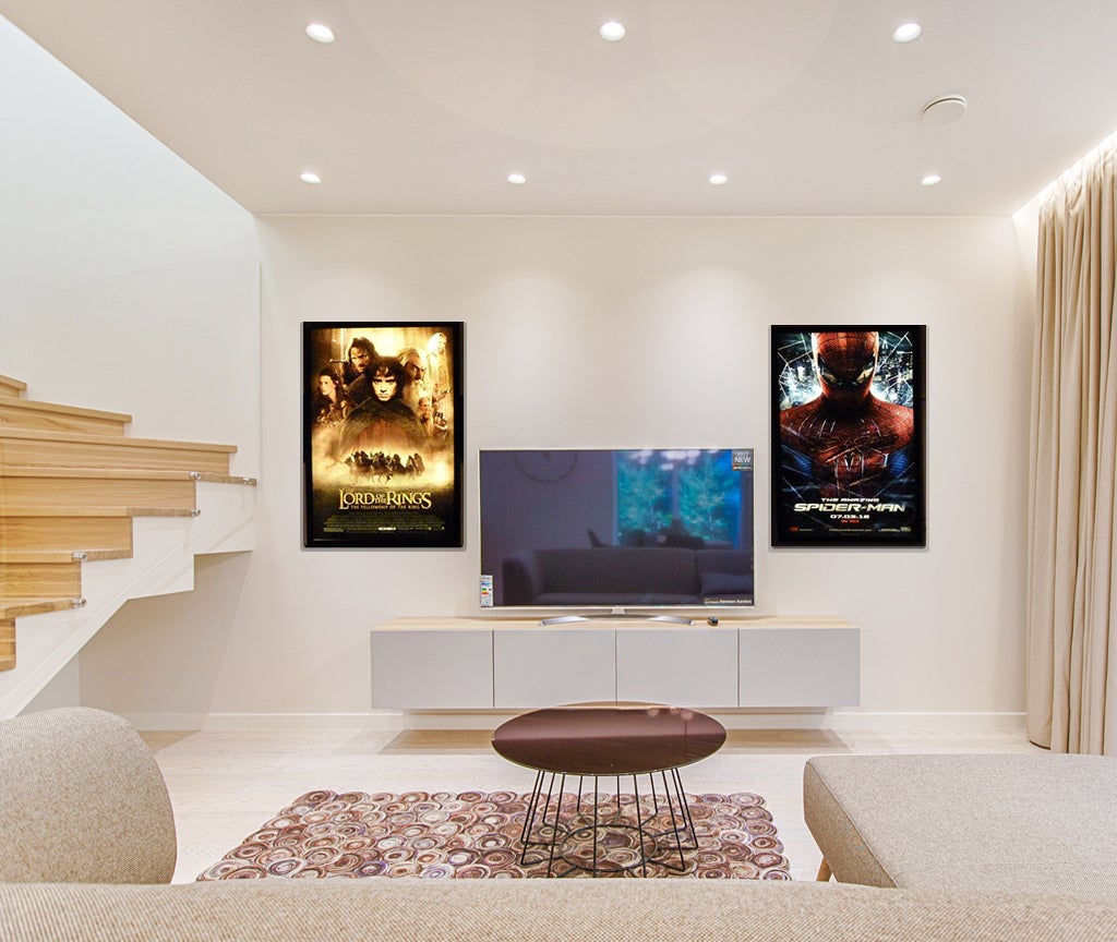 Two movie posters with backlit frames