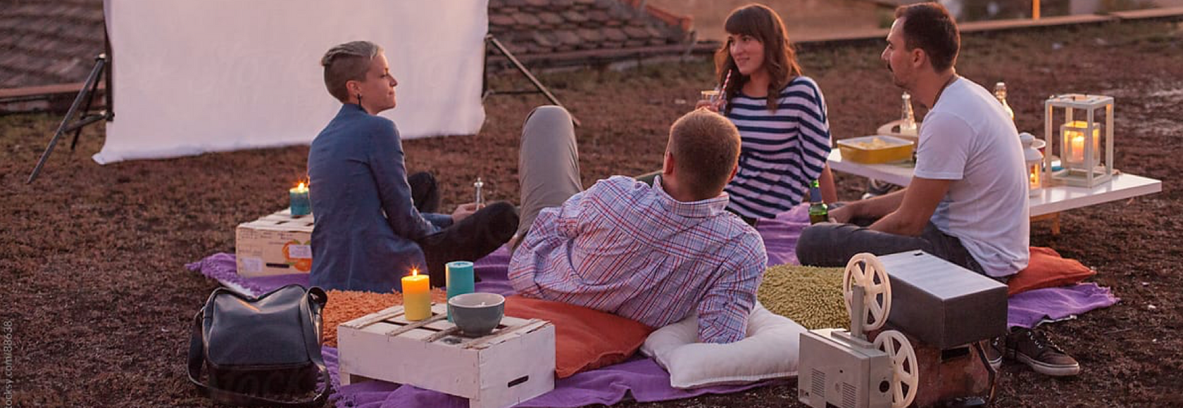 Friends watching movies together outside