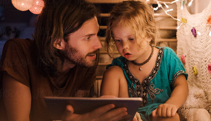 A father and daughter watching movies together
