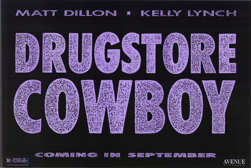 A movie poster for 'Drugstore Cowboy' featuring the title in large, textured lavender-purple letters on a black background, with cast names Matt Dillon and Kelly Lynch along the left side and 'Coming in September' printed along the right.