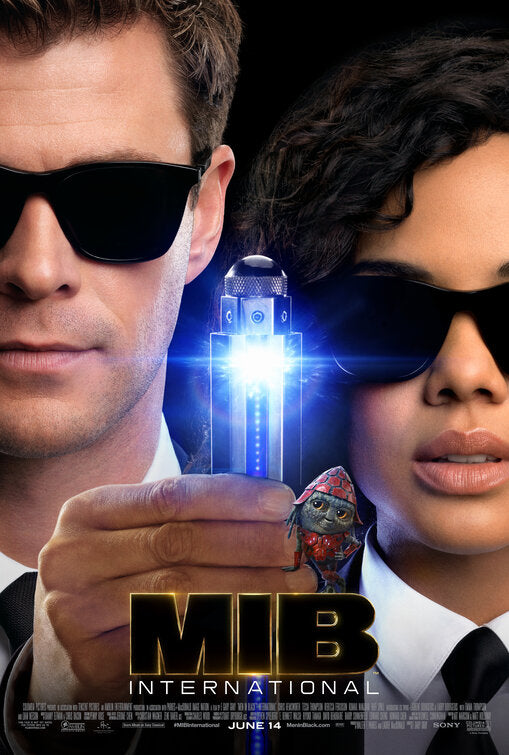 This image presents a movie poster for "Men in Black International," featuring a sleek and intriguing design. At the center, we see two characters: a man on the left, played by Chris Hemsworth, dressed in a classic black suit and sunglasses, exuding a confident charm.